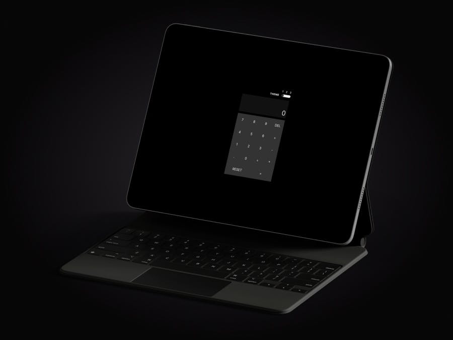 A dark-themed calculator application on an iMac screen