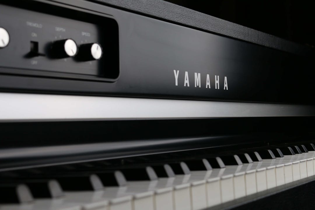 A close-up of a Yamaha keyboard, with the brand in clear view