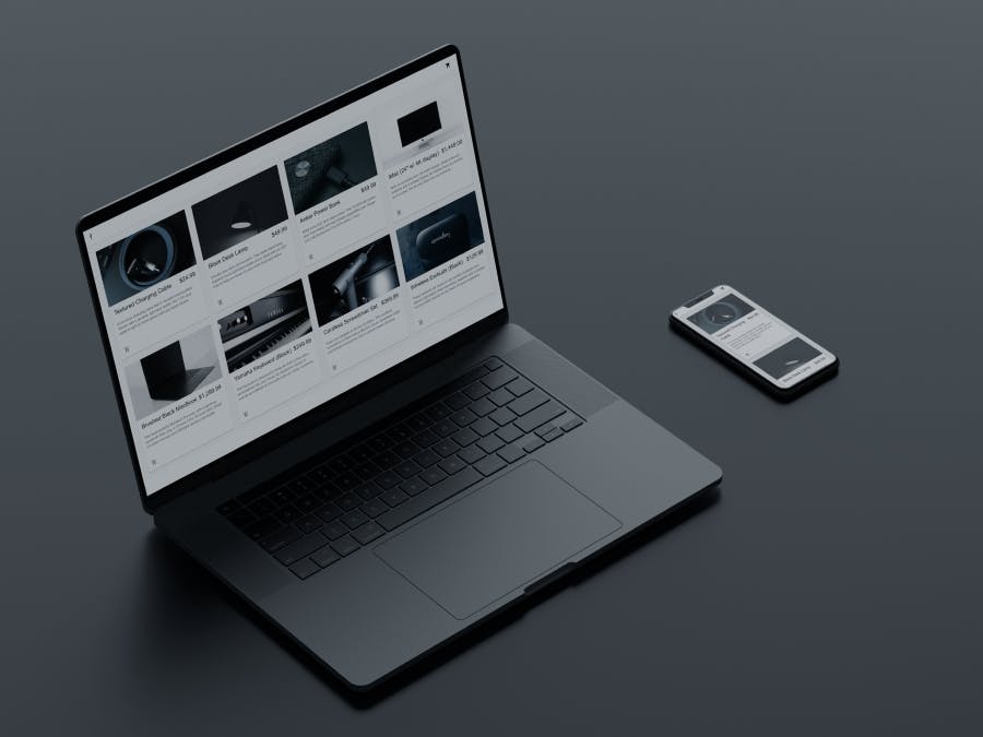 A side view of a Macbook and iPhone with an ecommerce site open on the screens